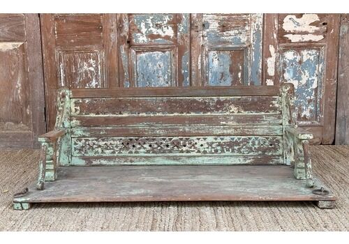 Decorative Teak Swing With Faded Green Paint Tones And Brass Chains