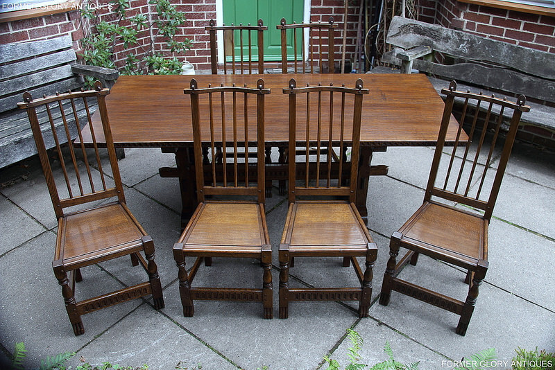 A Nigel Griffiths Solid Carved Oak Dining Set Table & Six Stick Back Chairs photo furniture