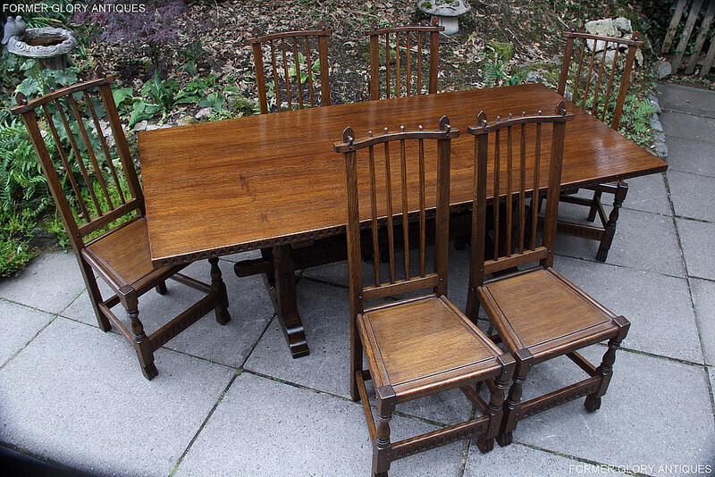 A Nigel Griffiths Solid Carved Oak Dining Set Table & Six Stick Back Chairs photo for sale