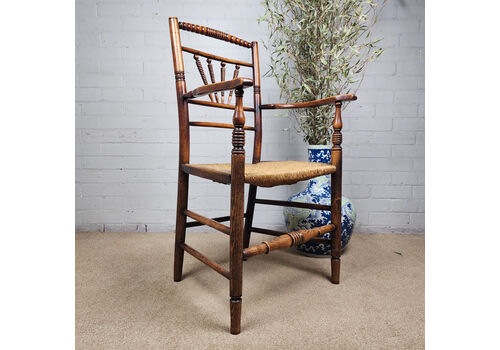 A George III Elm And Fruitwood Spindle Back Carver Chair